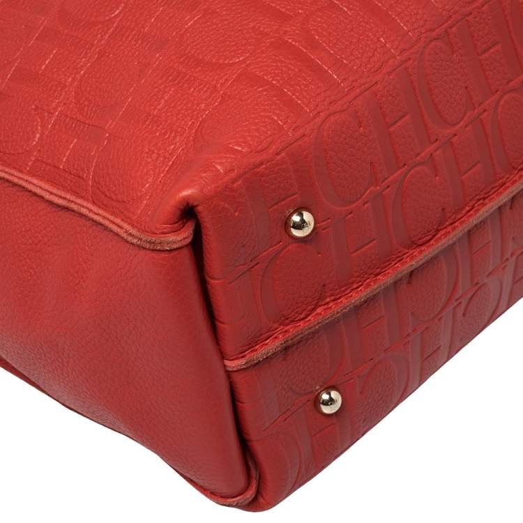 Pre Owned Carolina Herrera Red Monogram Embossed Leather Tassel Hobo