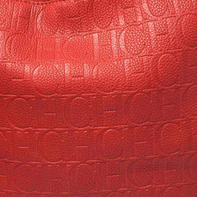 Pre Owned Carolina Herrera Red Monogram Embossed Leather Tassel Hobo