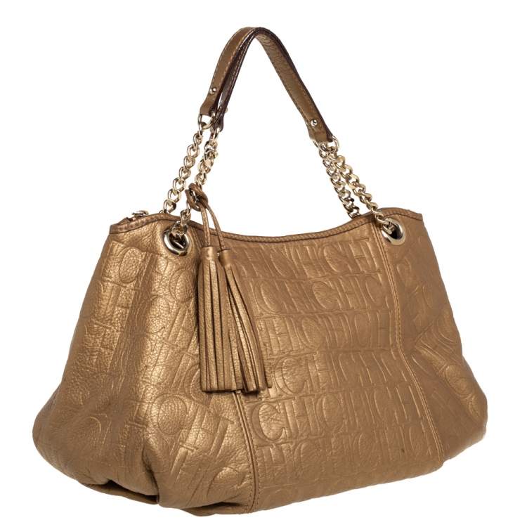 Pre Owned Carolina Herrera Golden Brown Monogram Embossed Leather Tassel Hobo