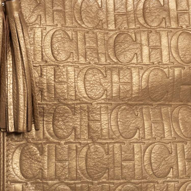 Pre Owned Carolina Herrera Golden Brown Monogram Embossed Leather Tassel Hobo