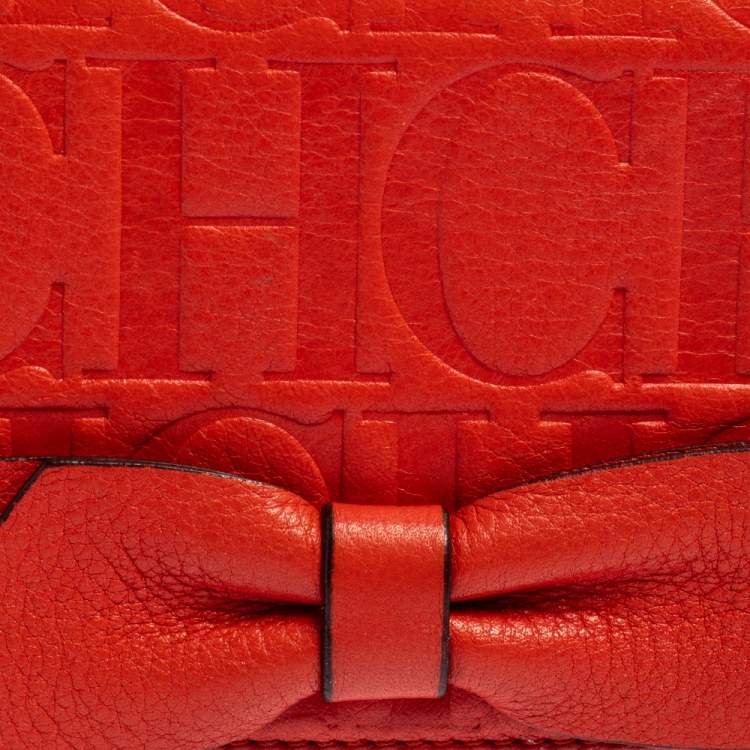 Pre Owned Carolina Herrera Orange Embossed Leather Bow Trifold Wallet