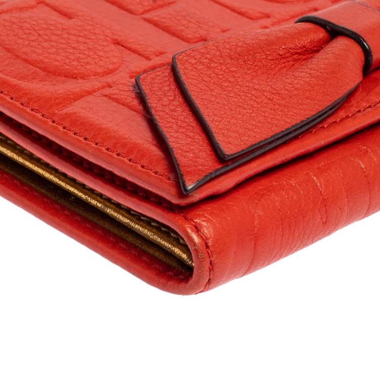 Pre Owned Carolina Herrera Orange Embossed Leather Bow Trifold Wallet