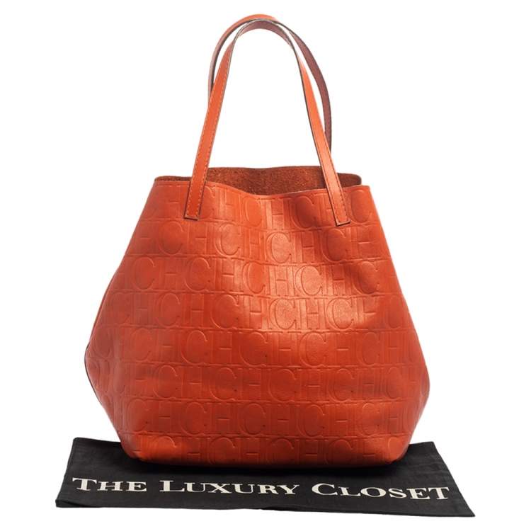 Pre Owned Carolina Herrera Orange Monogram Embossed Leather Matryoshka Tote