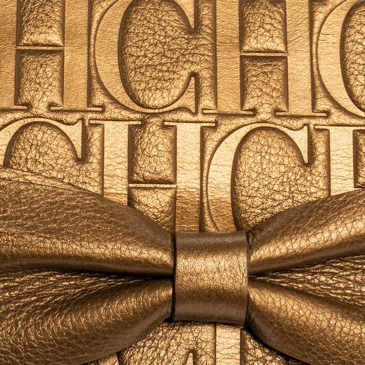 Pre Owned Carolina Herrera Gold Monogram Embossed Leather Bow Chain Clutch 