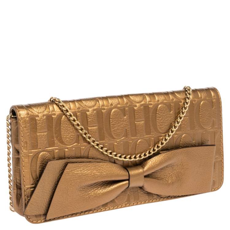Pre Owned Carolina Herrera Gold Monogram Embossed Leather Bow Chain Clutch 