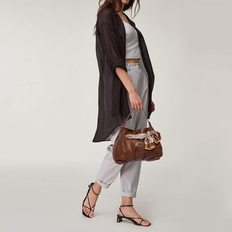 Pre Owned Carolina Herrera Brown Monogram Embossed Leather Scarf Hobo