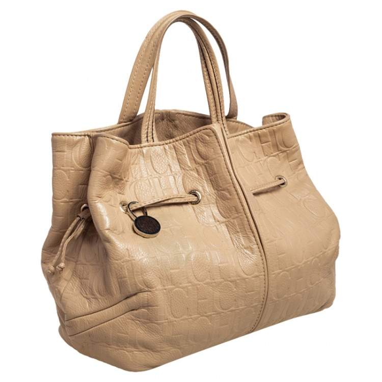Pre Owned Carolina Herrera Beige Monogram Embossed Leather Drawstring Tote