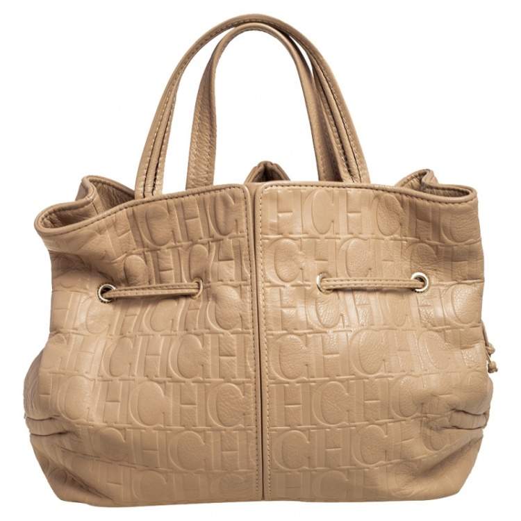 Pre Owned Carolina Herrera Beige Monogram Embossed Leather Drawstring Tote