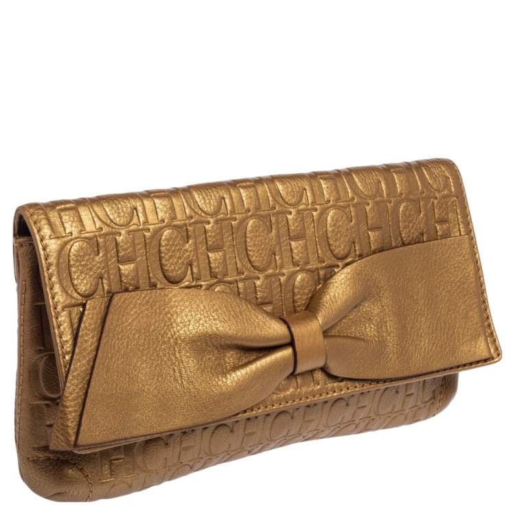 Pre Owned Carolina Herrera Gold Monogram Embossed Leather Bow Flap Clutch