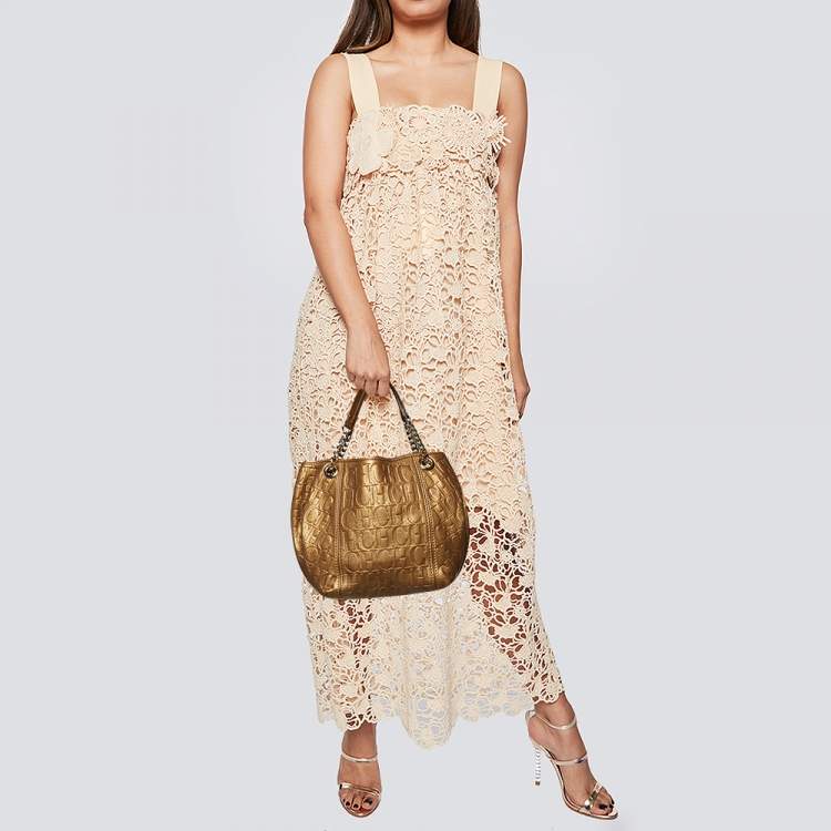 Pre Owned Carolina Herrera Gold Monogram Embossed Leather Chain Hobo