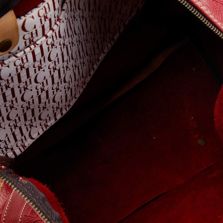 Pre Owned Carolina Herrera Red Monogram Embossed Leather Large Andy Boston Bag
