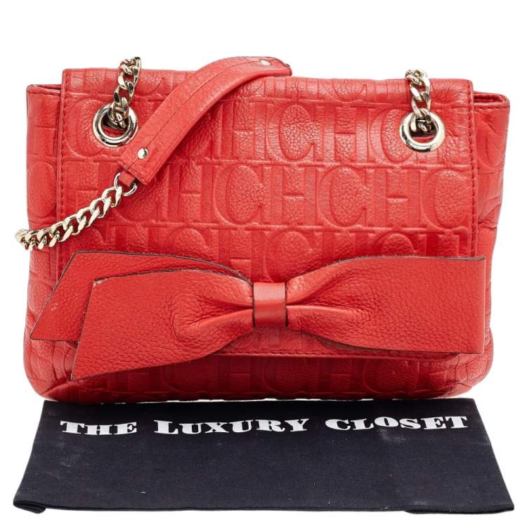 Pre Owned Carolina Herrera Orange Monogram Embossed Leather Bow Flap Shoulder Bag