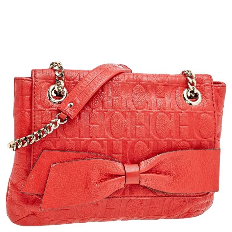 Pre Owned Carolina Herrera Orange Monogram Embossed Leather Bow Flap Shoulder Bag