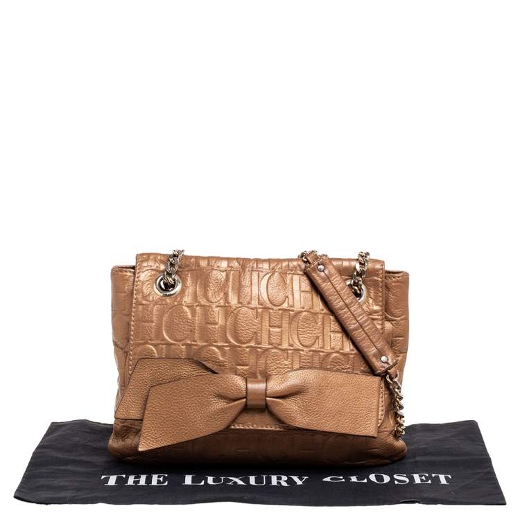 Pre Owned Carolina Herrera Metallic Gold Monogram Embossed Leather Bow Flap Shoulder Bag