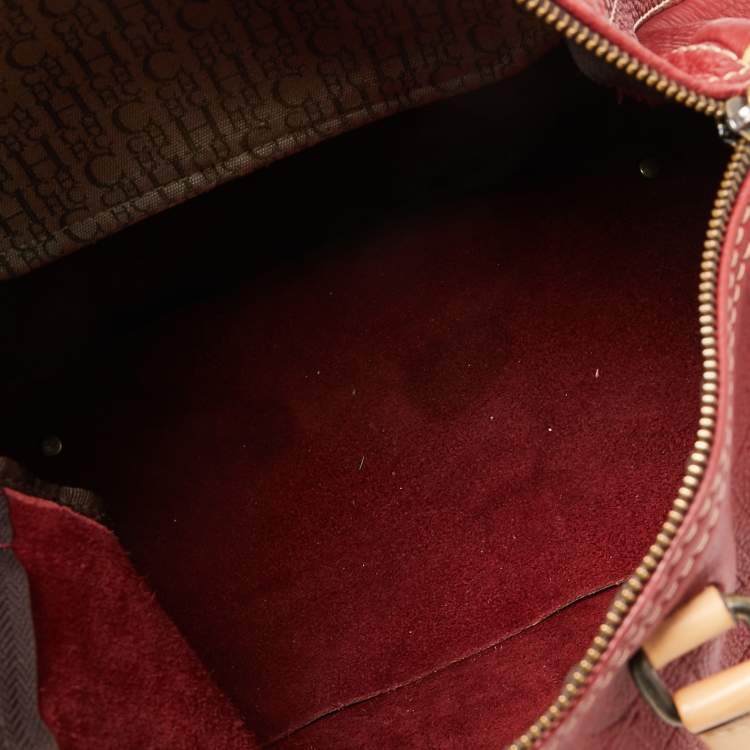 Pre Owned Carolina Herrera Red Monogram Embossed Leather Large Andy Boston Bag