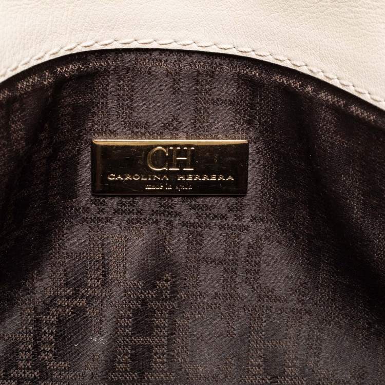 Pre Owned Carolina Herrera Off White/Gold Laser Cut Leather Tassel Clutch