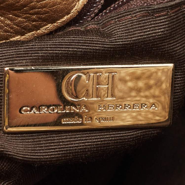 Pre Owned Carolina Herrera Gold Monogram Embossed Leather Bow Bucket Hobo