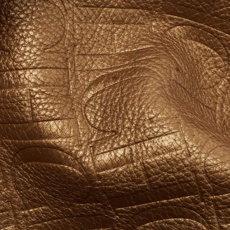 Pre Owned Carolina Herrera Gold Monogram Embossed Leather Bow Bucket Hobo