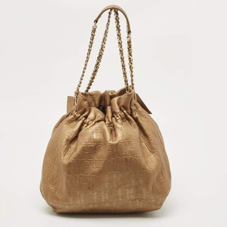 Pre Owned Carolina Herrera Gold Monogram Embossed Leather Bow Bucket Hobo