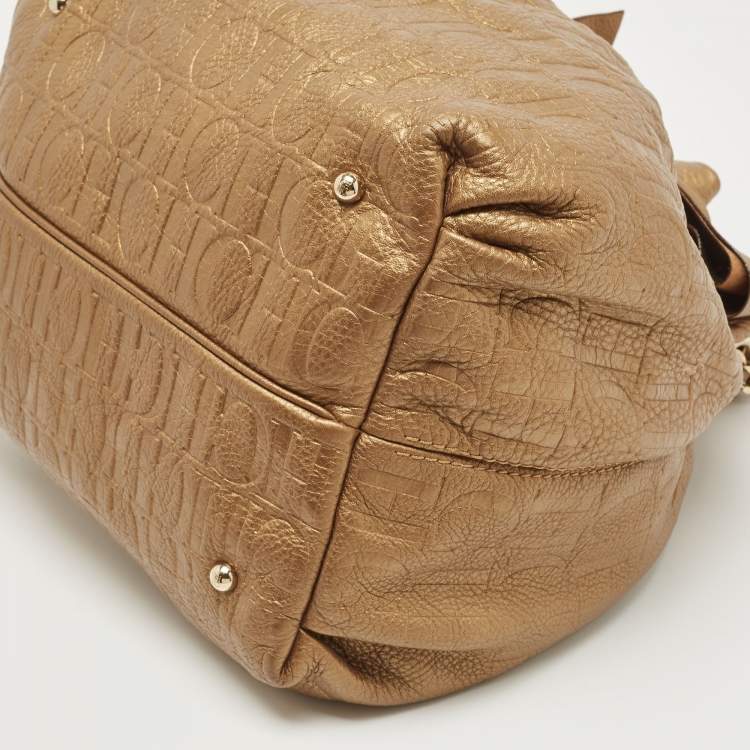 Pre Owned Carolina Herrera Gold Monogram Embossed Leather Bow Bucket Hobo