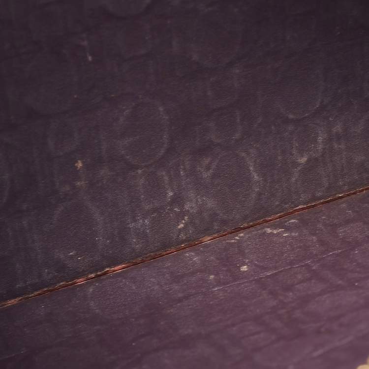 Pre Owned Carolina Herrera Burgundy Monogram Embossed Leather Zip Wristlet Pouch