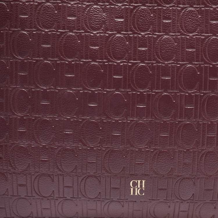 Pre Owned Carolina Herrera Burgundy Monogram Embossed Leather Zip Wristlet Pouch