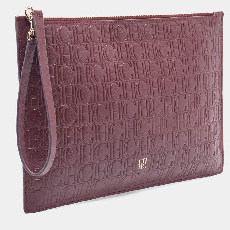 Pre Owned Carolina Herrera Burgundy Monogram Embossed Leather Zip Wristlet Pouch