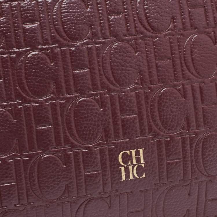Pre Owned Carolina Herrera Burgundy Monogram Embossed Leather Zip Wristlet Pouch