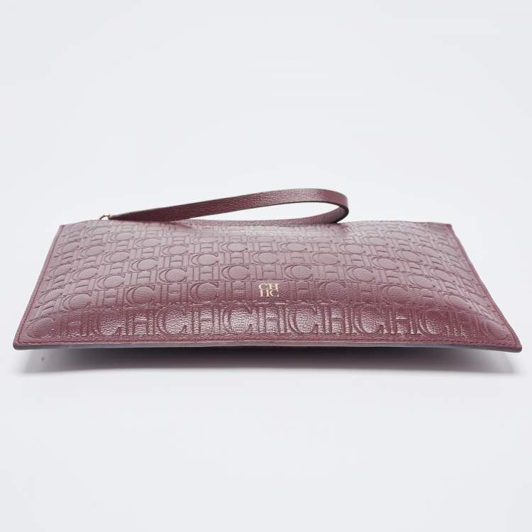 Pre Owned Carolina Herrera Burgundy Monogram Embossed Leather Zip Wristlet Pouch