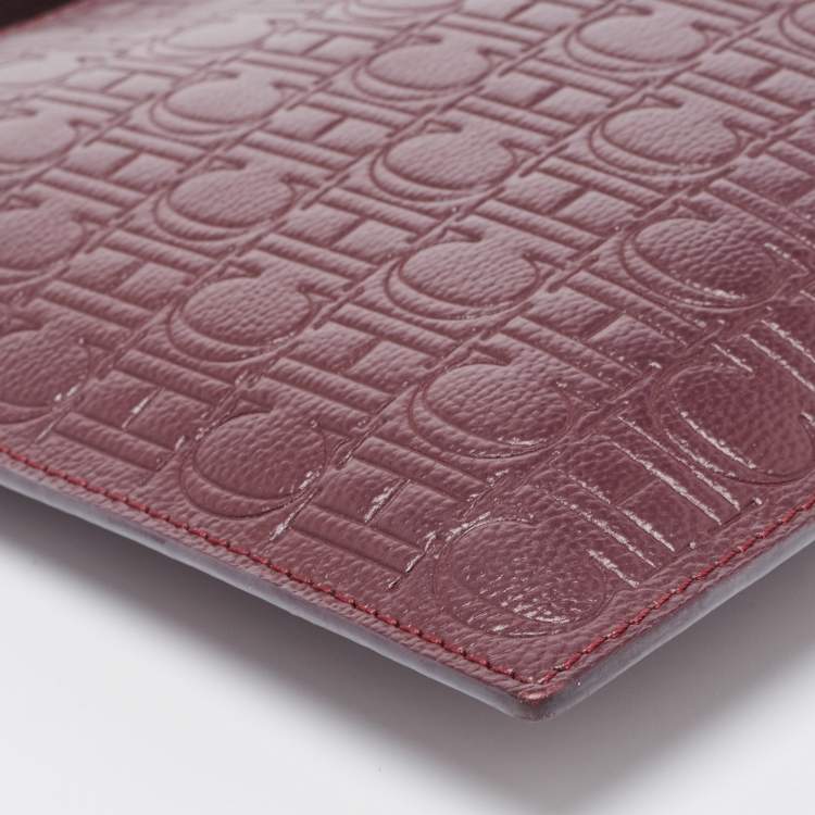 Pre Owned Carolina Herrera Burgundy Monogram Embossed Leather Zip Wristlet Pouch