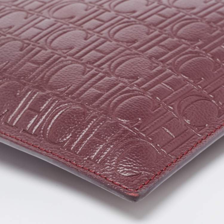 Pre Owned Carolina Herrera Burgundy Monogram Embossed Leather Zip Wristlet Pouch