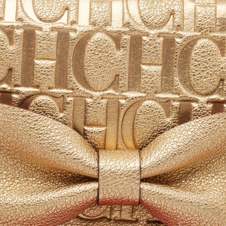 Pre Owned Carolina Herrera Gold Monogram Embossed Leather Bow Flap Clutch