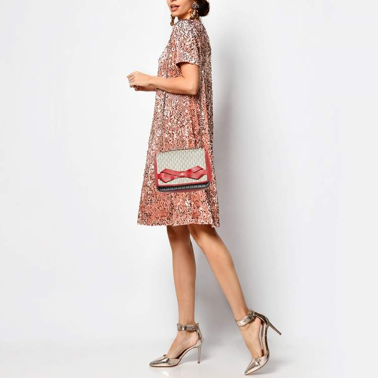 Pre Owned Carolina Herrera Red/White Monogram Coated Canvas and Leather Bow Flap Shoulder Bag