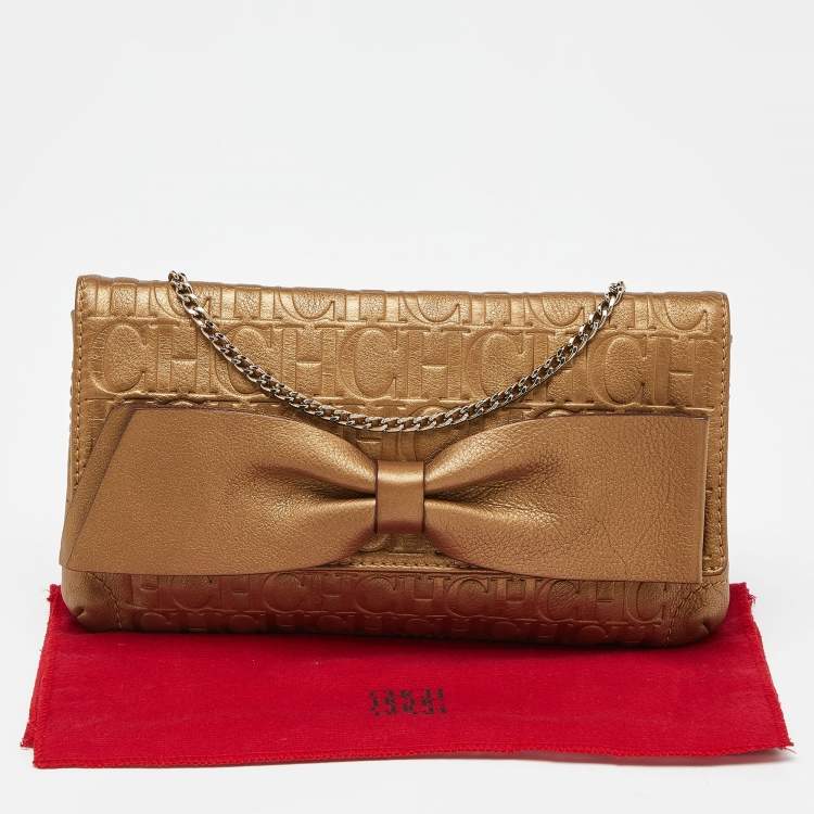 Pre Owned Caroline Herrera Gold Monogram Embossed Leather Bow Chain Clutch