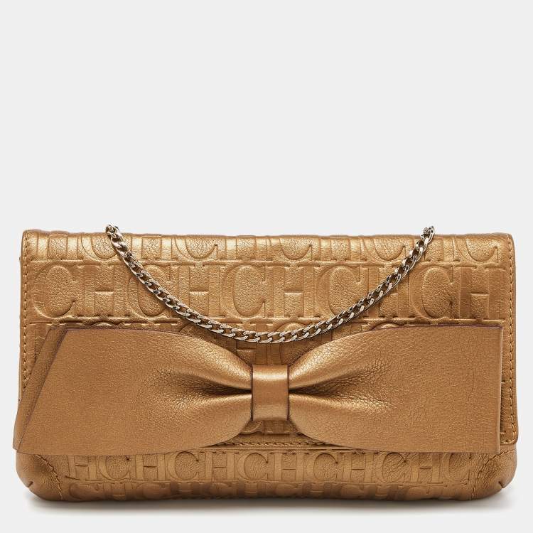 Pre Owned Caroline Herrera Gold Monogram Embossed Leather Bow Chain Clutch