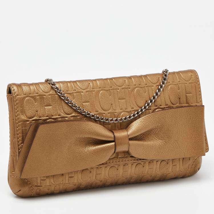 Pre Owned Caroline Herrera Gold Monogram Embossed Leather Bow Chain Clutch