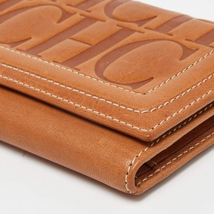 Pre Owned Carolina Herrera Brown Monogram Embossed Leather Trifold Continental Wallet