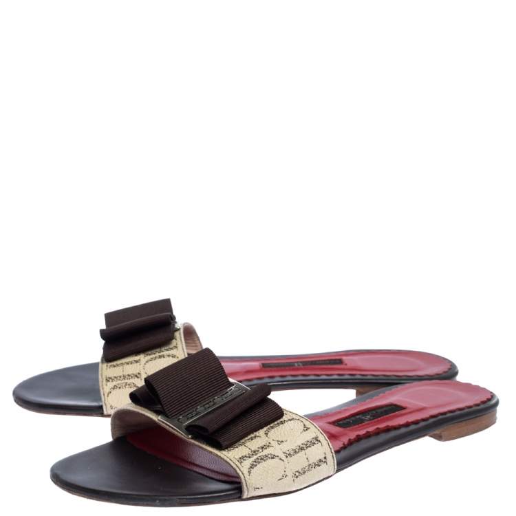 Pre Owned Carolina Herrera Brown CH Logo Coated Canvas Bow Detail Flat Slides Size 38