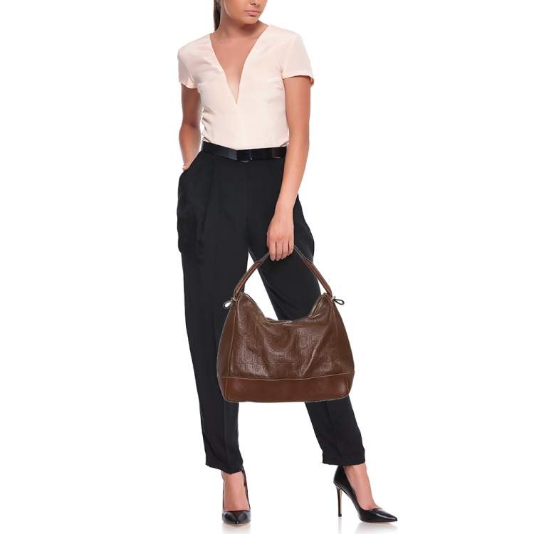 Pre Owned Carolina Herrera Brown Monogram Embossed Leather Hobo