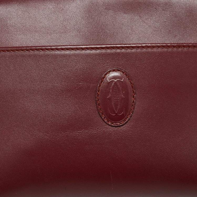 Pre Owned Cartier Burgundy Leather Must de Cartier Zip Pouch Clutch