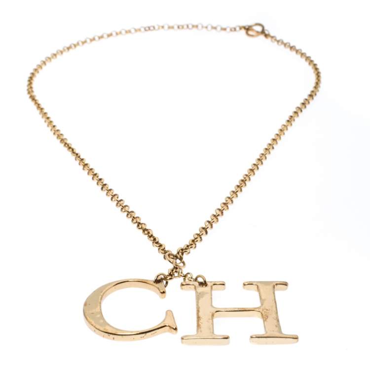 Pre Owned CH Carolina Herrera Logo Charm Gold Tone Long Toggle Pendant Necklace