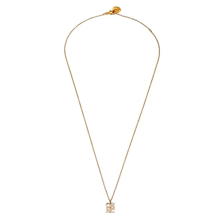 Pre Owned CH Carolina Herrera Crystal Logo Pendant Gold Tone Necklace