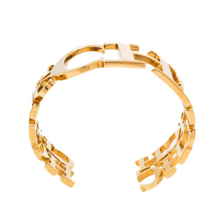 Pre Owned CH Carolina Herrera Logo Gold Tone Open Cuff Bracelet