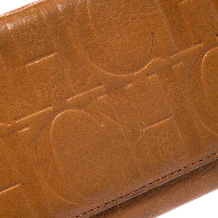 Pre Owned CH Carolina Herrera Mustard Monogram Embossed Leather Trifold Continental Wallet