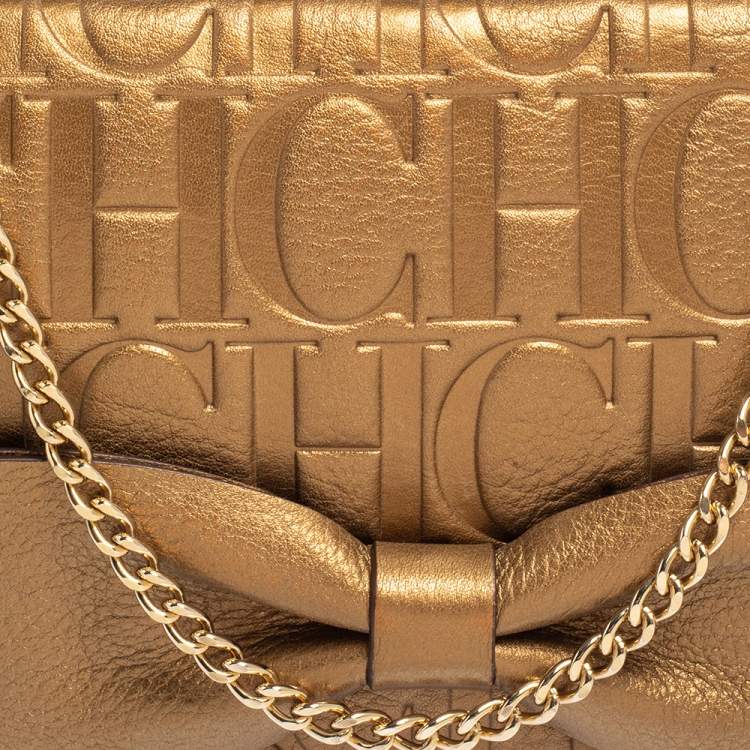 Pre Owned Carolina Herrera Gold Monogram Embossed Leather Bow Chain Clutch 