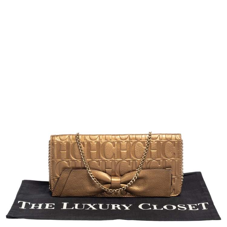 Pre Owned Carolina Herrera Gold Monogram Embossed Leather Bow Chain Clutch 