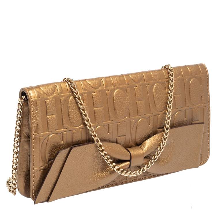 Pre Owned Carolina Herrera Gold Monogram Embossed Leather Bow Chain Clutch 