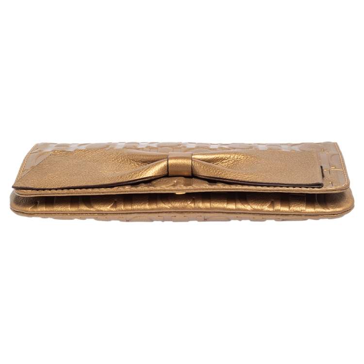 Pre Owned Carolina Herrera Gold Monogram Embossed Leather Bow Chain Clutch 