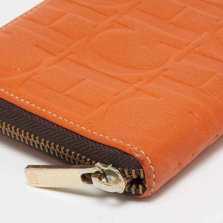 Pre Owned CH Carolina Herrera Orange Monogram Embossed Leather Zip Around Wallet