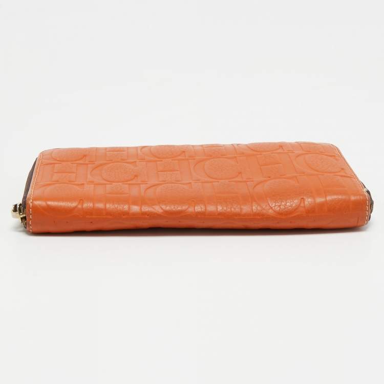 Pre Owned CH Carolina Herrera Orange Monogram Embossed Leather Zip Around Wallet